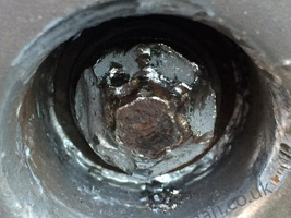 A badly damaged wheel nut which had been worked on for hours by several garaged daming the wheel.  We removed this easily. 